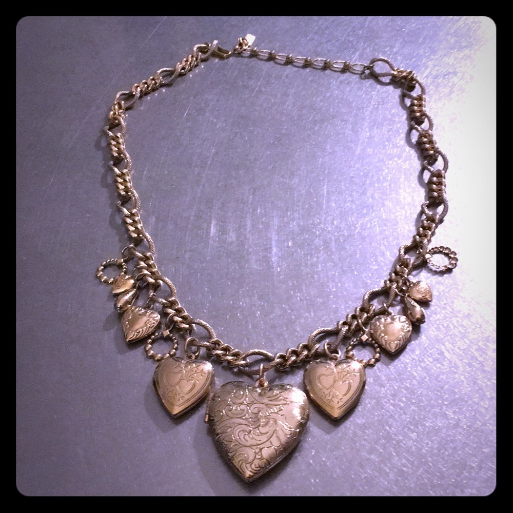 Shiny hearts dripping off of an 18” gold chain